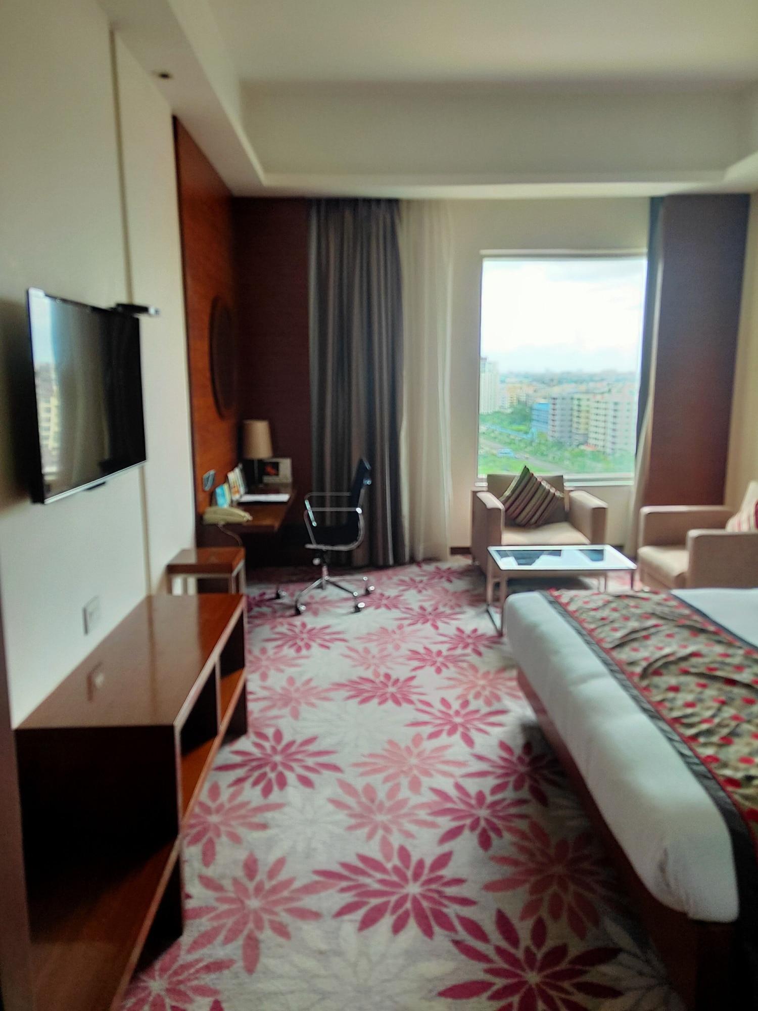 Pride Plaza Hotel, Calcutta Extérieur photo A room at the hotel
